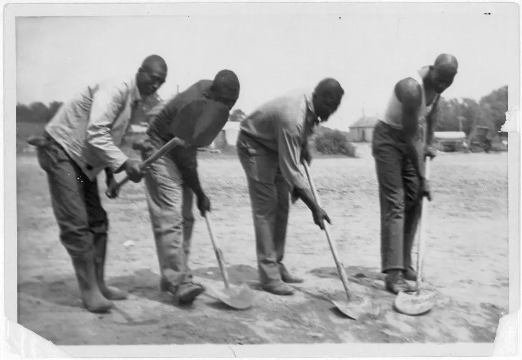 African American convicts working with shovels, possibly at Darrington State Farm, Texas, 1934, or Cummins State Farm, Gould, Arkansas, 1934